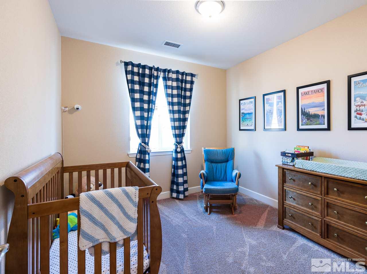 10155 Toltec Court Reno, NV 89521 - Photo 13 of 19 a bedroom with furniture and a window