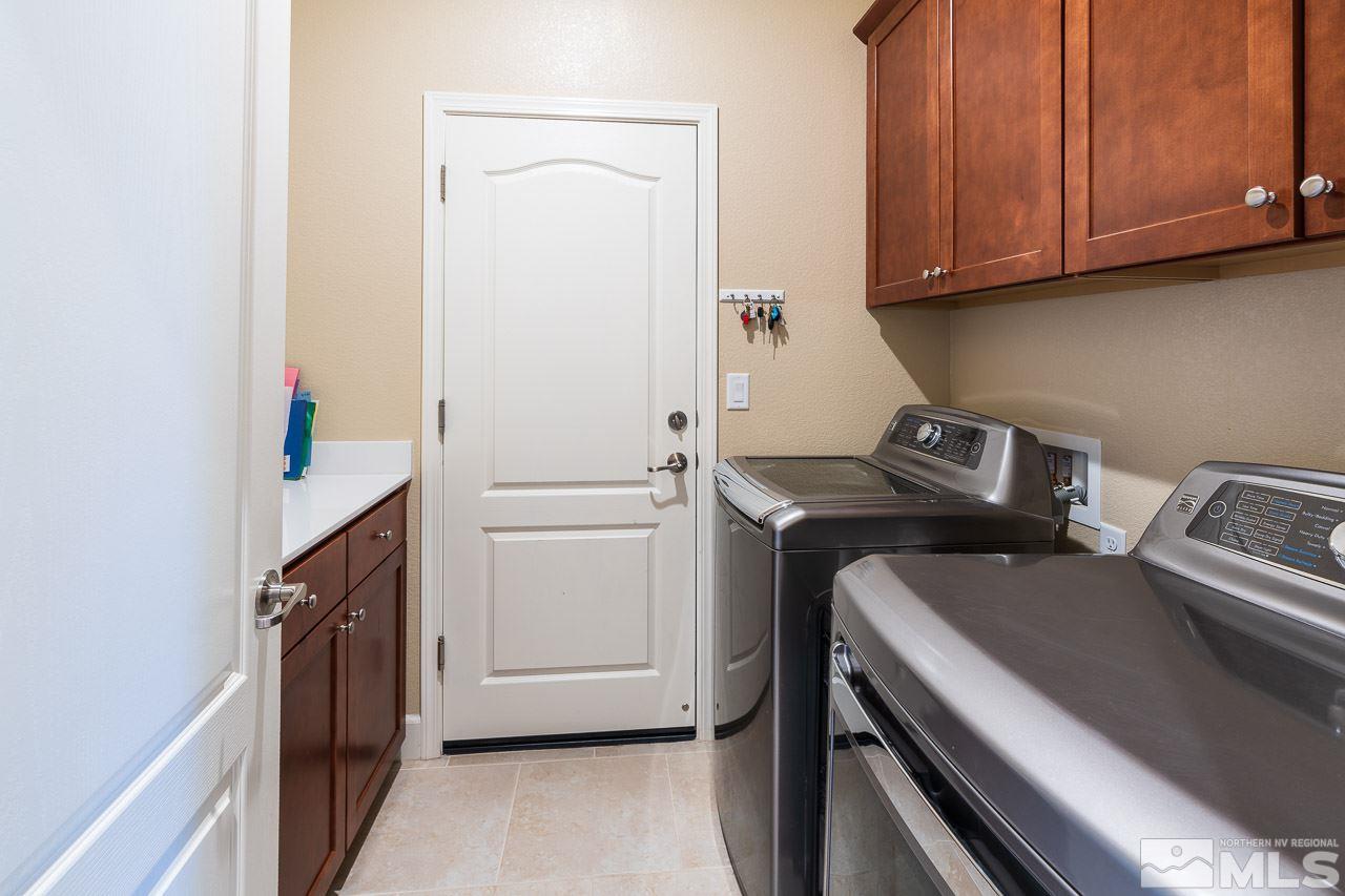 10155 Toltec Court Reno, NV 89521 - Photo 14 of 19 a utility room with dryer and washer