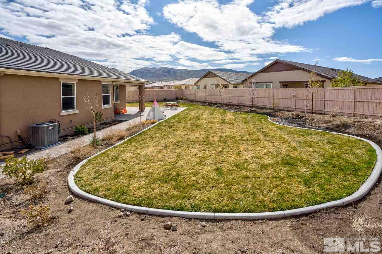 10155 Toltec Court Reno, NV 89521 - Photo 16 of 19 a view of swimming pool with a chairs