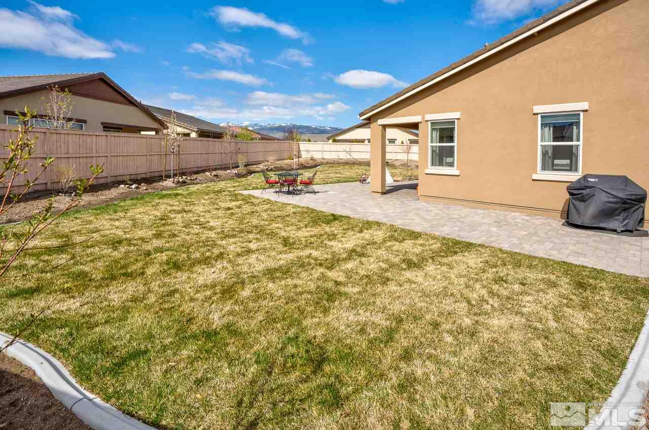 10155 Toltec Court Reno, NV 89521 - Photo 18 of 19 a view of a backyard of the house
