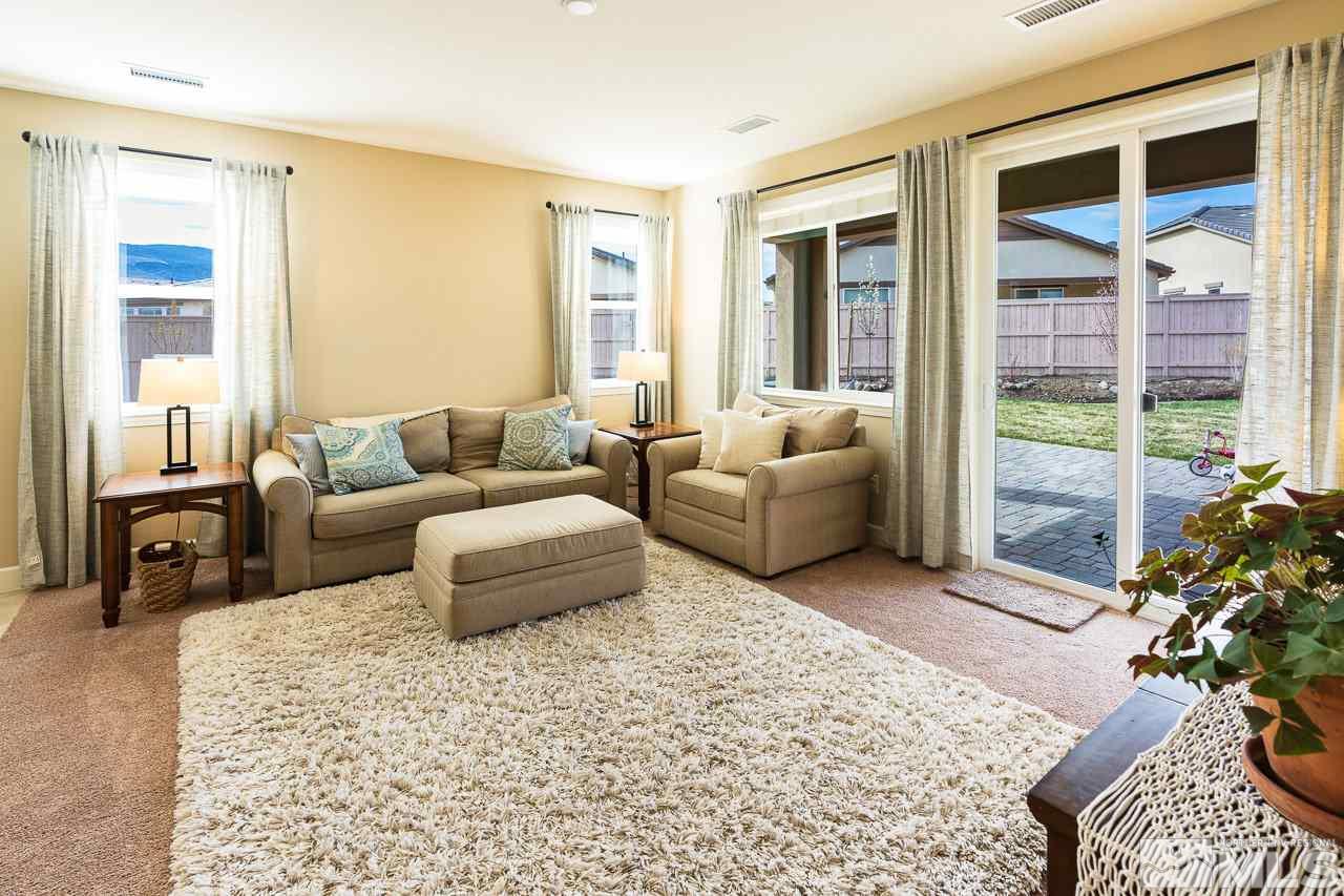 10155 Toltec Court Reno, NV 89521 - Photo 5 of 19 a living room with furniture and a large window