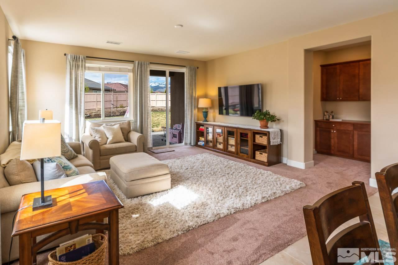 10155 Toltec Court Reno, NV 89521 - Photo 6 of 19 a living room with furniture and a flat screen tv