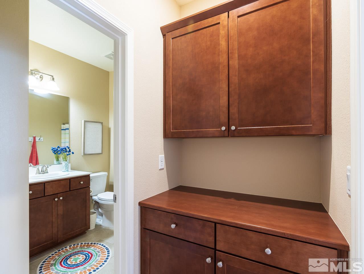 10155 Toltec Court Reno, NV 89521 - Photo 10 of 19 a room with a mirror and cabinets