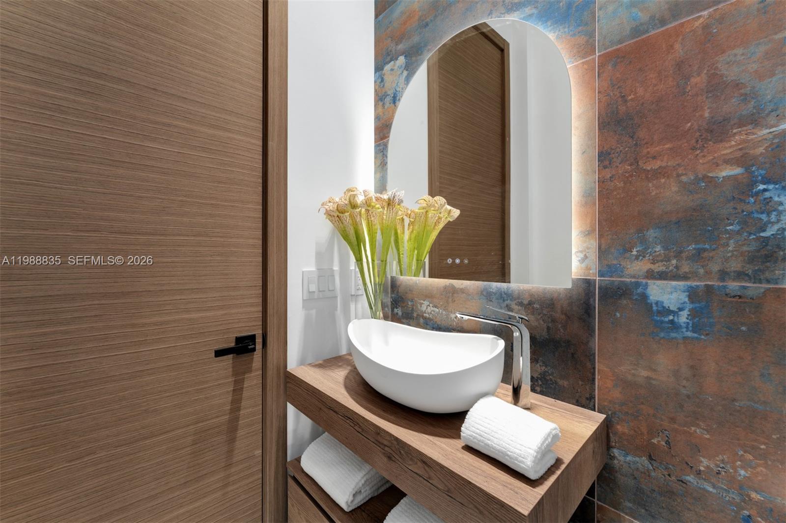 9790 Southwest 114th Street Miami, FL 33176 - Photo 16 of 47 a bathroom with a toilet sink and mirror