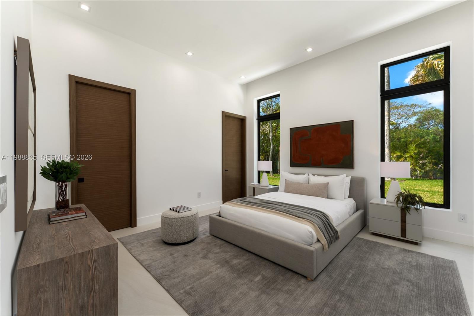 9790 Southwest 114th Street Miami, FL 33176 - Photo 21 of 47 a bedroom with a bed and a flat screen tv