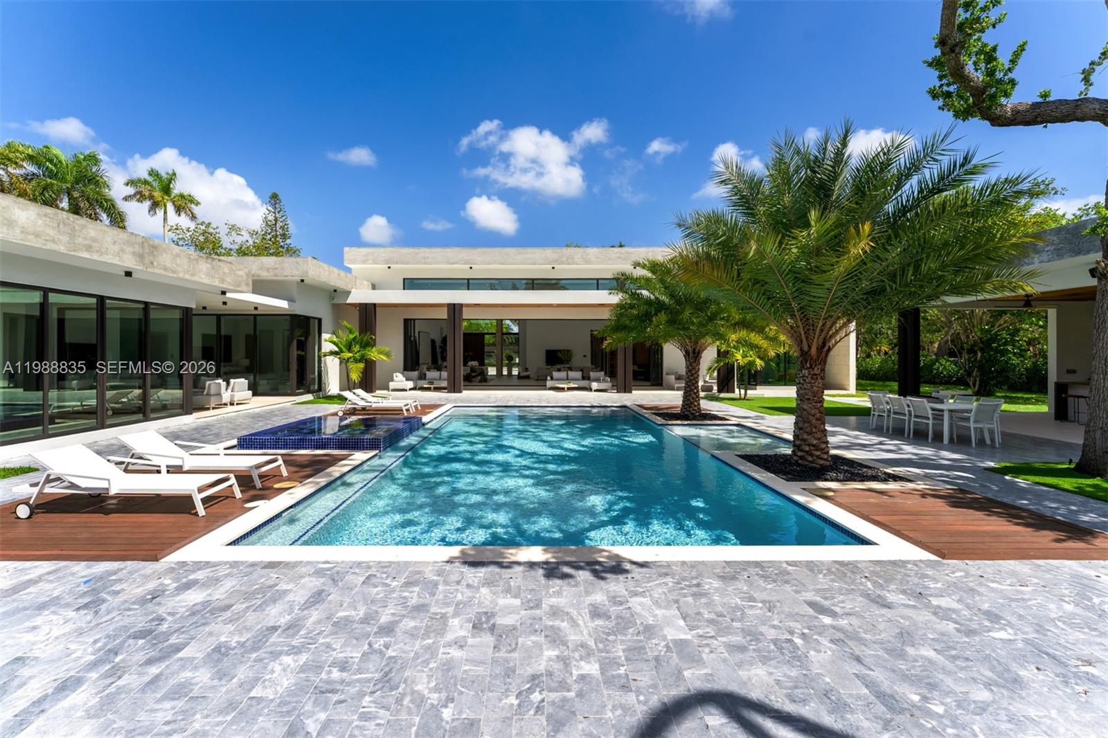 9790 Southwest 114th Street Miami, FL 33176 - Photo 27 of 47 a view of a swimming pool with a patio