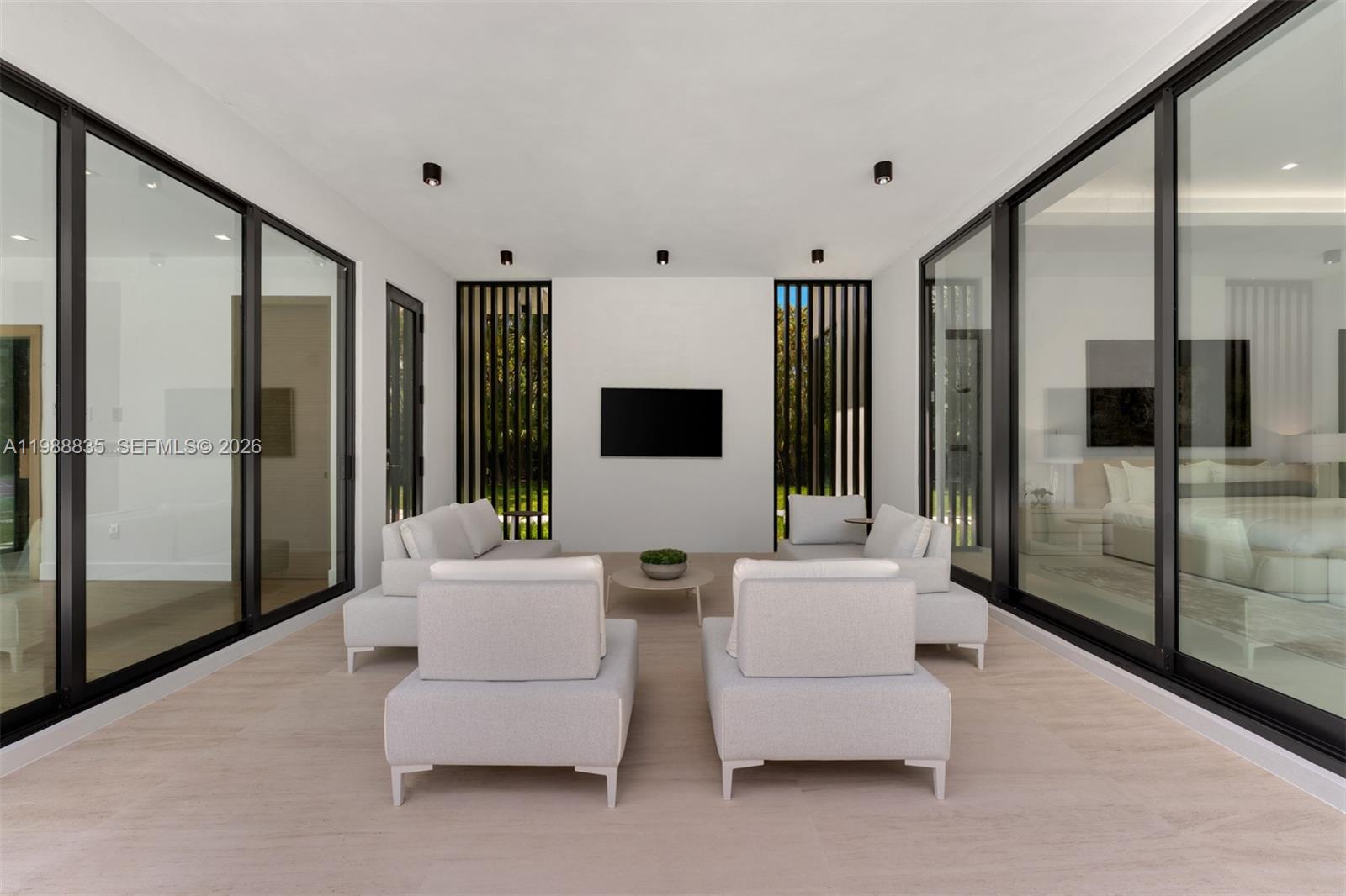 9790 Southwest 114th Street Miami, FL 33176 - Photo 30 of 47 a living room with furniture and a glass door