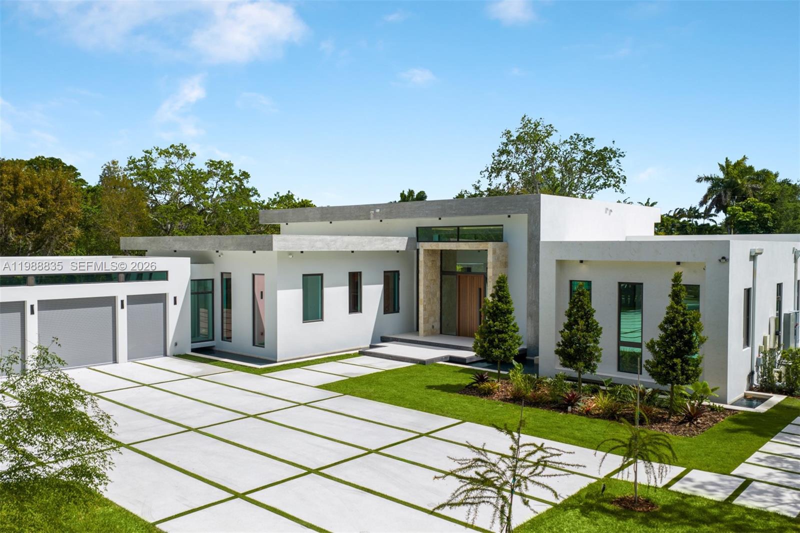 9790 Southwest 114th Street Miami, FL 33176 - Photo 36 of 47 a front view of a house with a yard