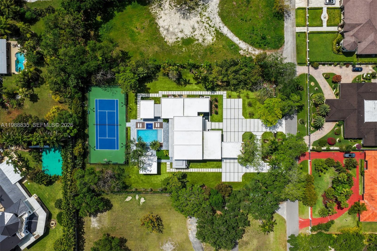 9790 Southwest 114th Street Miami, FL 33176 - Photo 39 of 47 an aerial view of residential house with outdoor space and trees all around