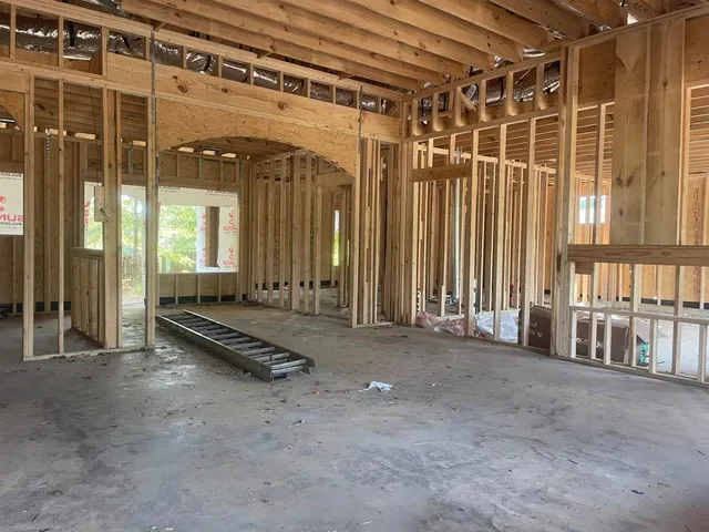 a view of a room with gym equipment and floor to ceiling window