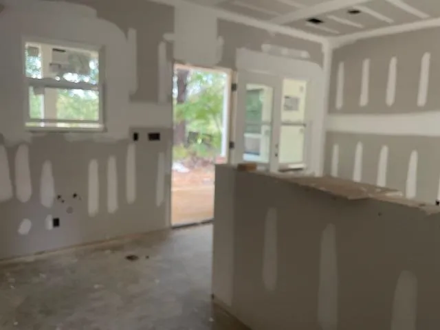 a view of a hallway with windows