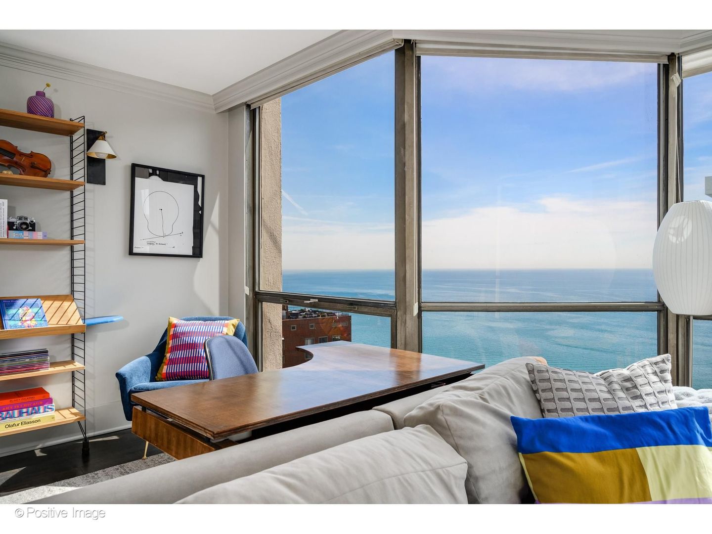 1310 North Ritchie Court, Unit 26C Chicago, IL 60610 - Photo 10 of 34 a living room with furniture and a floor to ceiling window