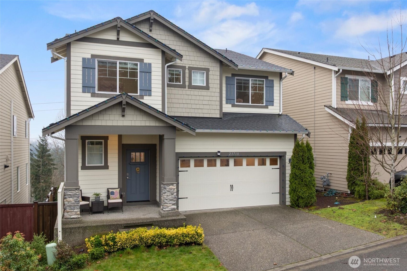 23718 43rd Drive Southeast Bothell, WA 98021 - Photo 1 of 40 a front view of a house with a yard