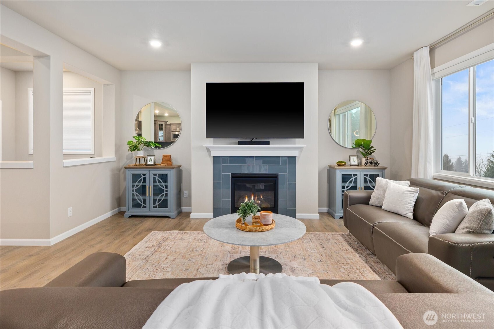 23718 43rd Drive Southeast Bothell, WA 98021 - Photo 17 of 40 a living room with furniture fireplace and a flat screen tv