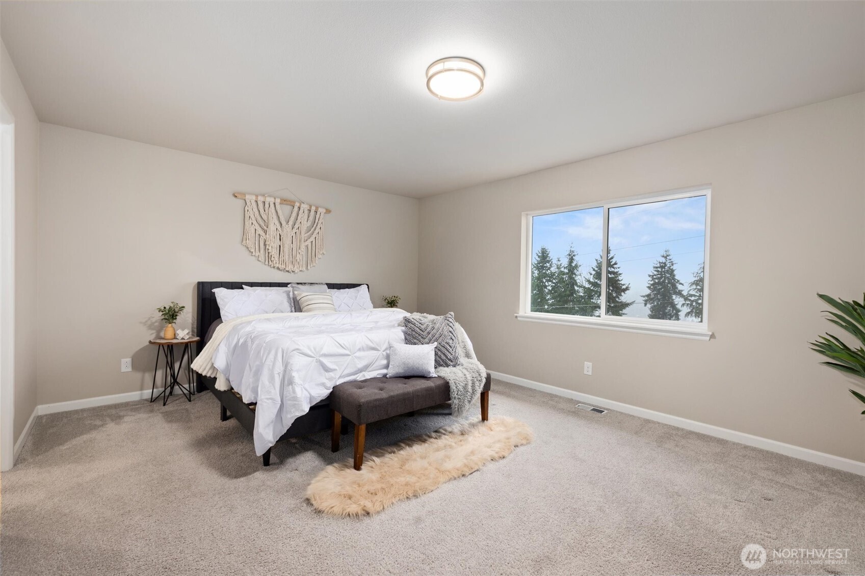 23718 43rd Drive Southeast Bothell, WA 98021 - Photo 20 of 40 a bedroom with a bed and a painting on the wall