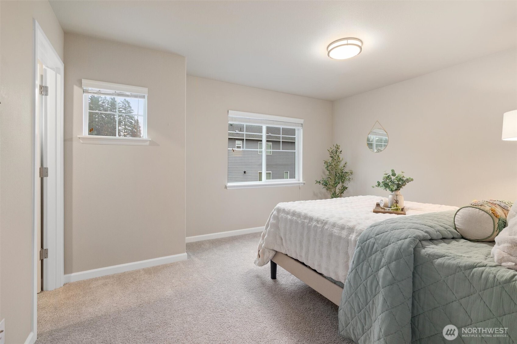 23718 43rd Drive Southeast Bothell, WA 98021 - Photo 29 of 40 a bedroom with a bed and windows
