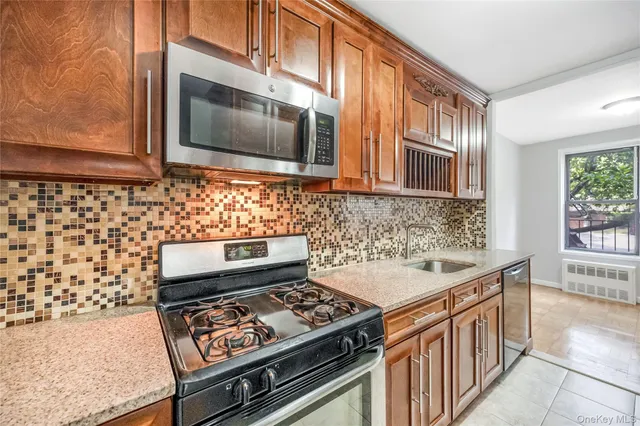 a kitchen with a stove and a microwave