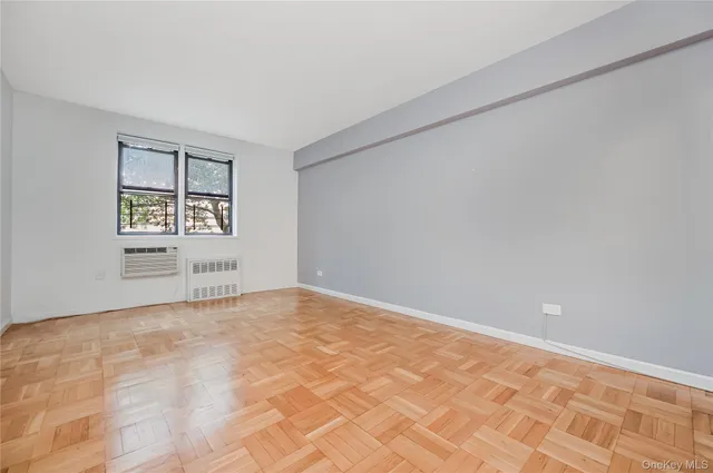 a view of an empty room with a window