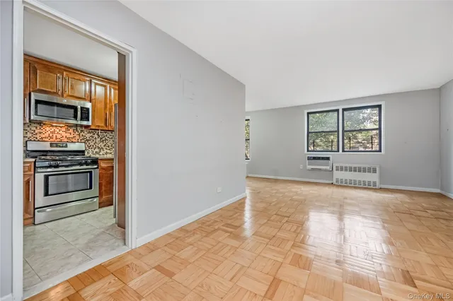a view of a kitchen with an oven and cabinets