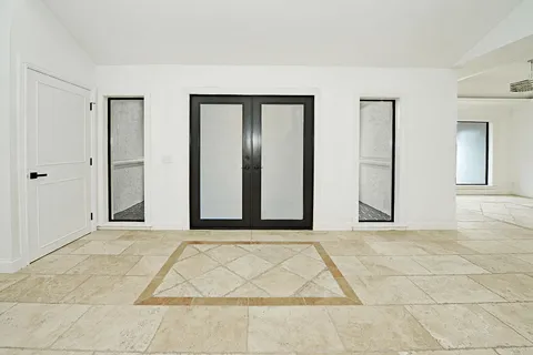 a view of a room with a large window