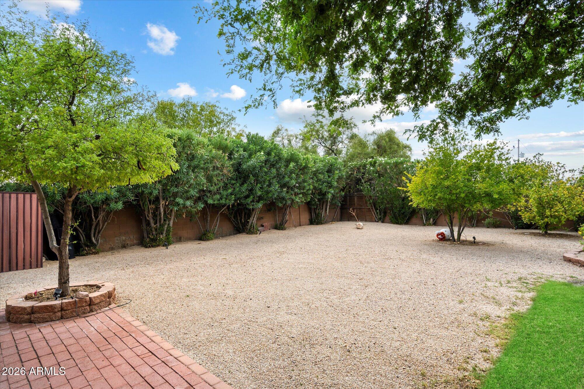 14242 North 9th Street Phoenix, AZ 85022 - Photo 17 of 26 a backyard of a house with trampoline