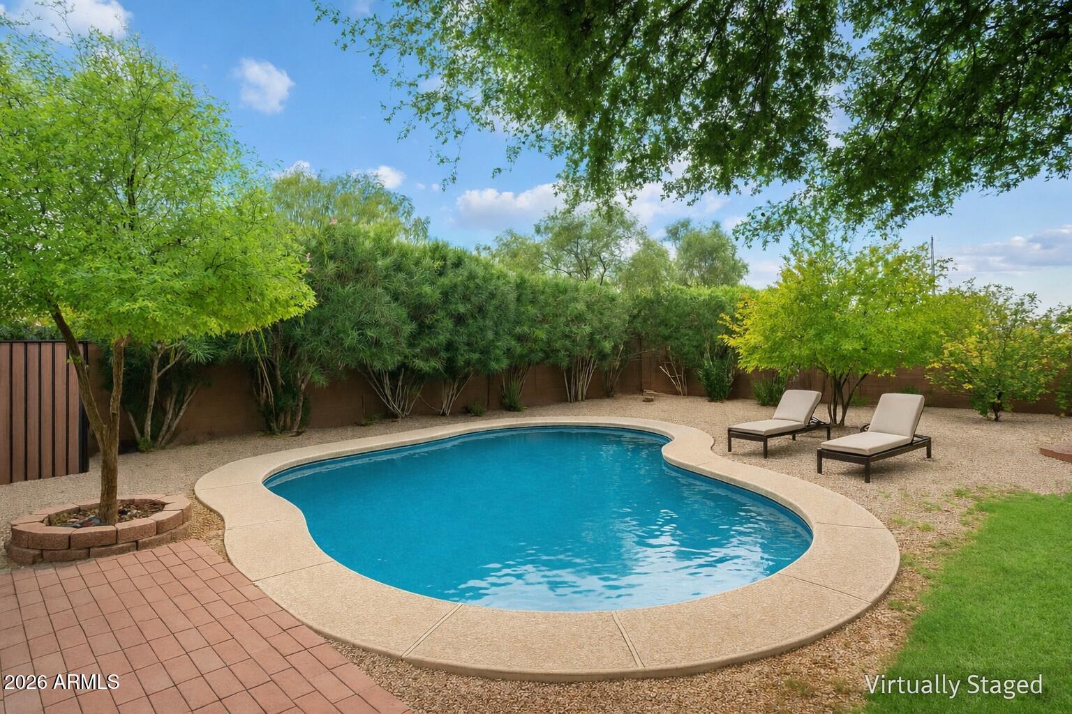 14242 North 9th Street Phoenix, AZ 85022 - Photo 18 of 26 a view of a swimming pool with a patio