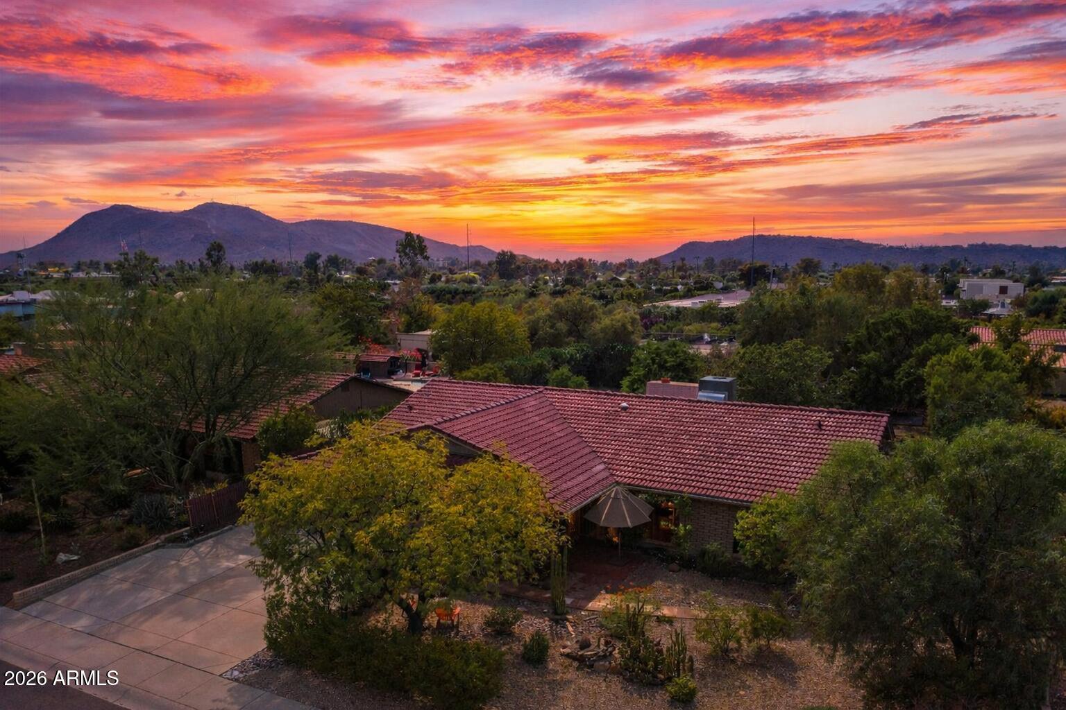 14242 North 9th Street Phoenix, AZ 85022 - Photo 25 of 26 a view of a lake with a mountain in the background