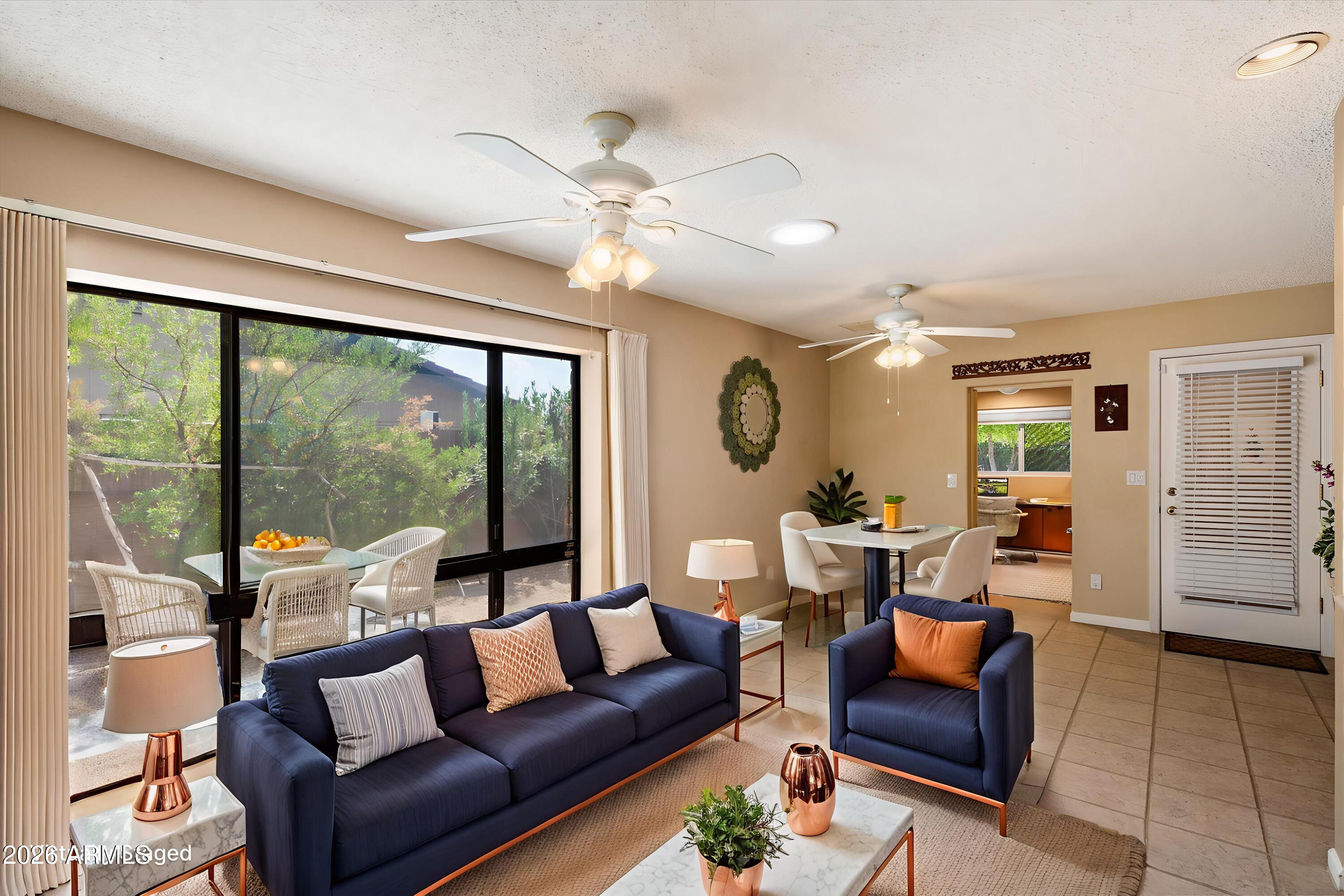 14242 North 9th Street Phoenix, AZ 85022 - Photo 4 of 26 a living room with furniture and a large window