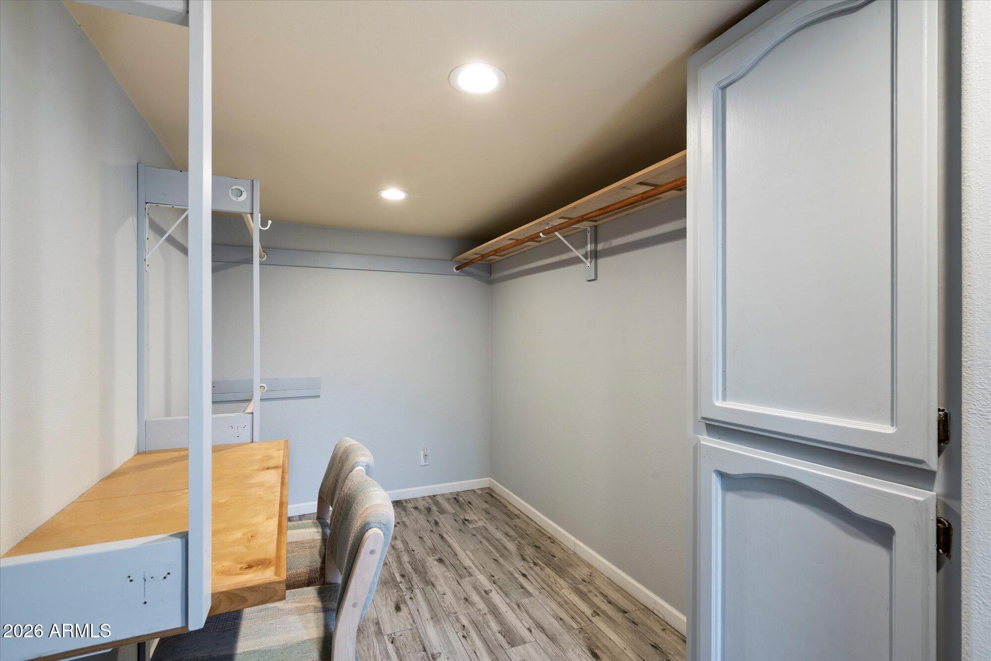 14242 North 9th Street Phoenix, AZ 85022 - Photo 8 of 26 a view of walk in closet with clothes and shoes