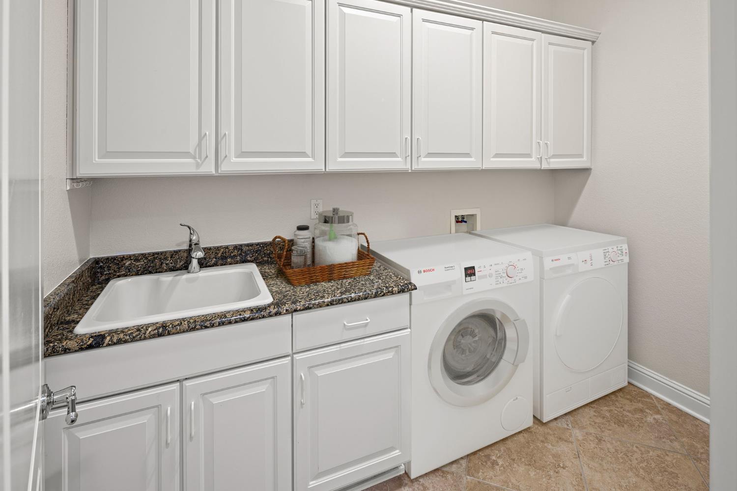 2144 Penstone Loop Roseville, CA 95747 - Photo 16 of 60 a utility room with dryer and washer