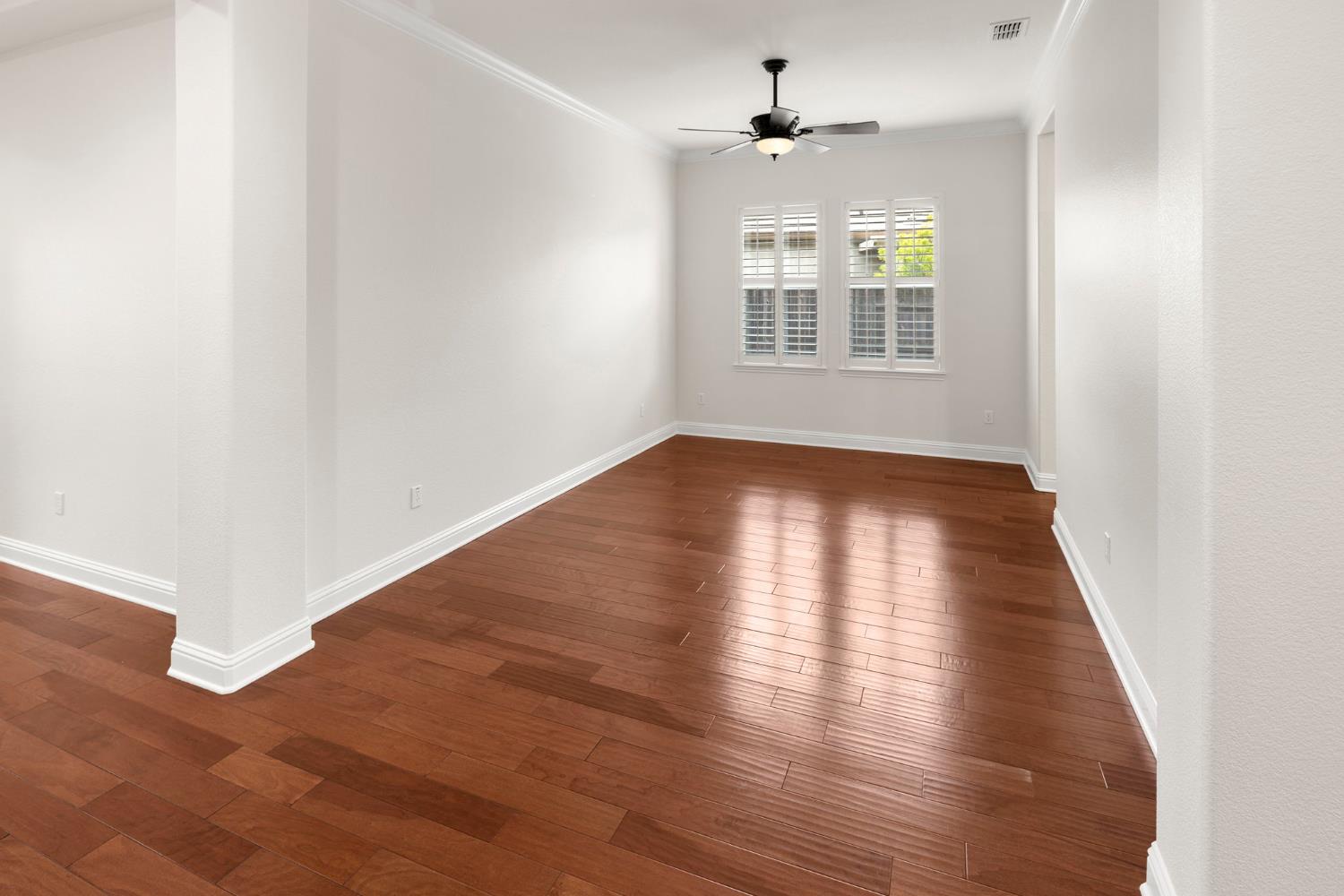 2144 Penstone Loop Roseville, CA 95747 - Photo 33 of 60 an empty room with wooden floor and windows