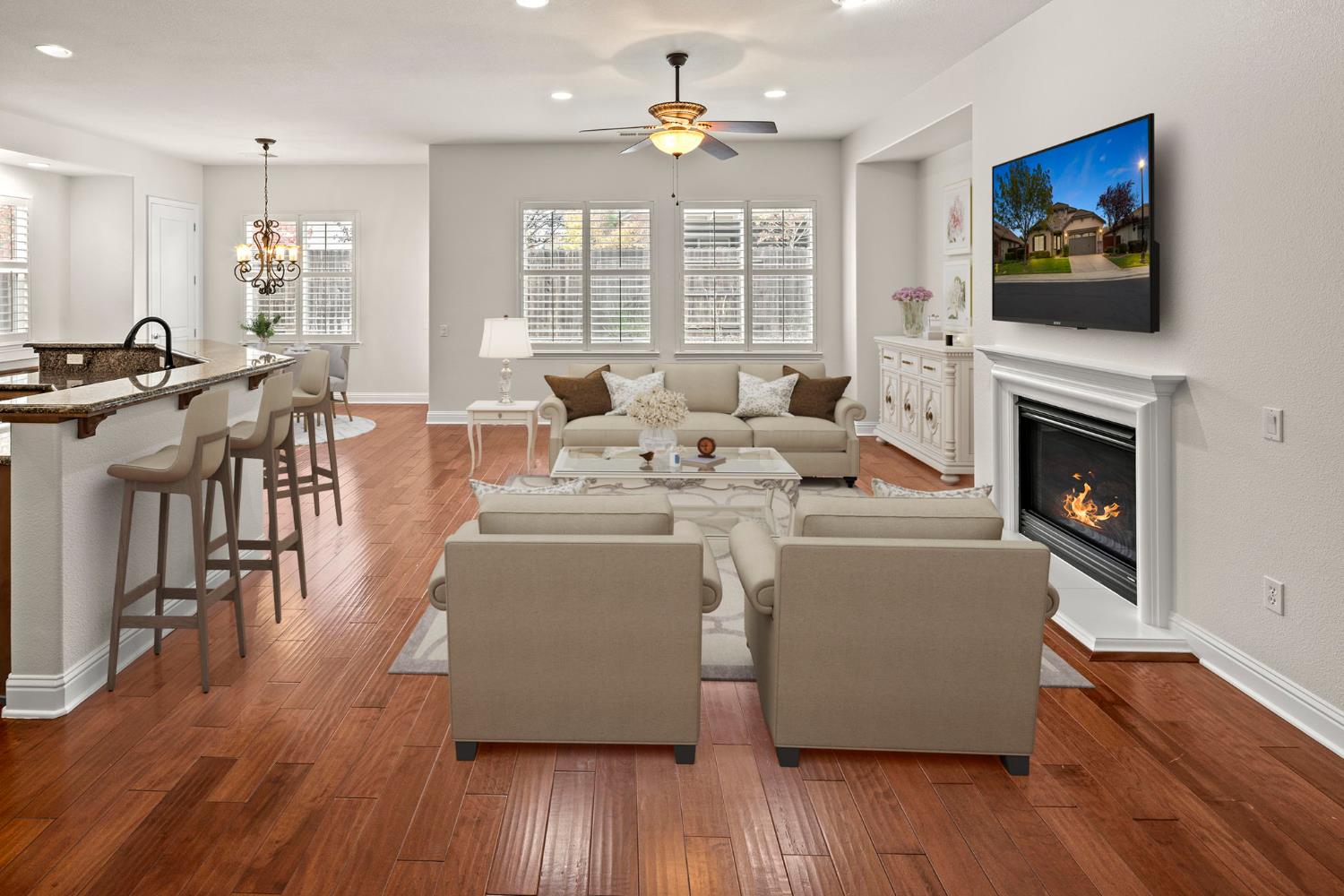 2144 Penstone Loop Roseville, CA 95747 - Photo 6 of 60 a living room with furniture a flat screen tv and a fireplace