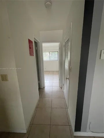 a bathroom with a sink and glass door