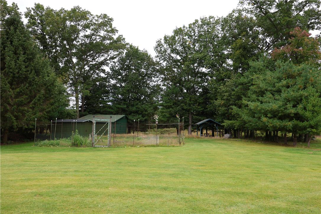 134 Bangor Junction Road Bangor, PA 18013 - Photo 15 of 18 Mature trees frame a spacious grassy clearing complete with practical outbuildings and fencing.