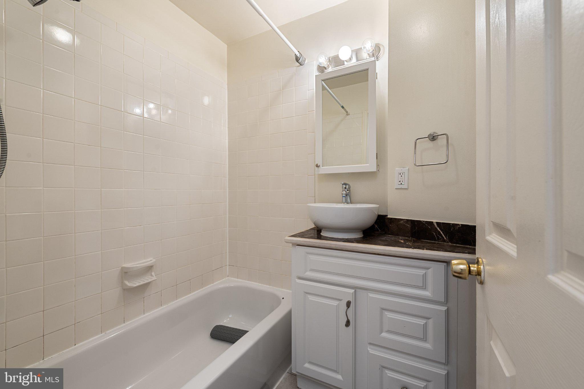 211 South Madeira Street Baltimore, MD 21231 - Photo 8 of 18 Charming bathroom with modern touches.