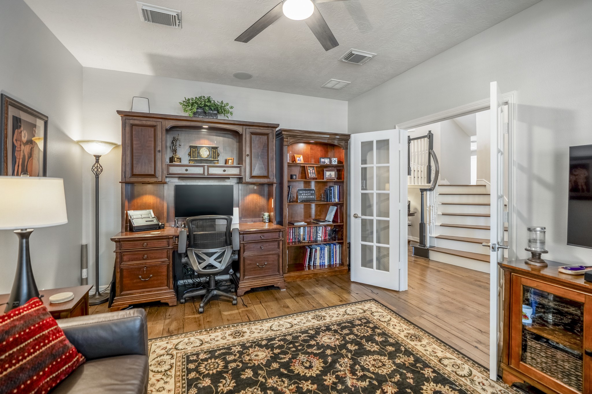 9707 Blue Cruls Way Spring, TX 77379 - Photo 17 of 50 a living room with furniture a rug and a flat screen tv