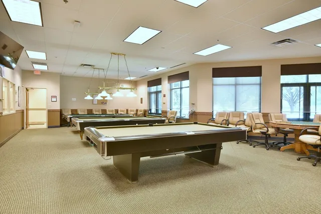 a view of a patio with table and chairs with wooden floor and fence