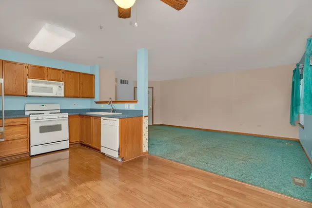 a kitchen with stainless steel appliances granite countertop a sink and a stove top oven