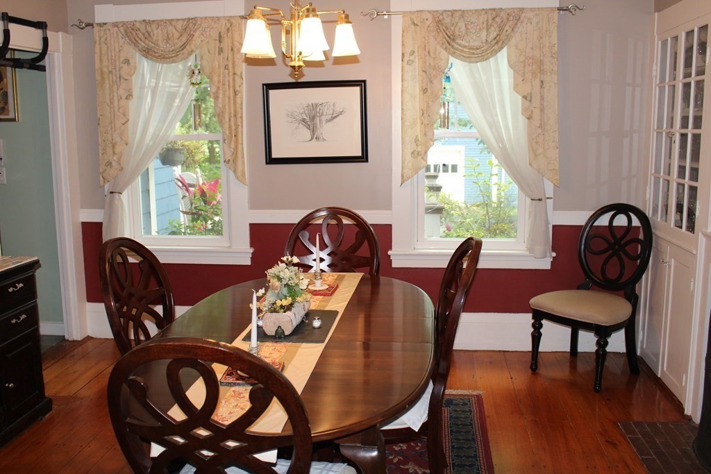 7 Grasshopper Lane Walpole, MA 02081 - Photo 11 of 42 a view of a dining room with furniture window and outside view