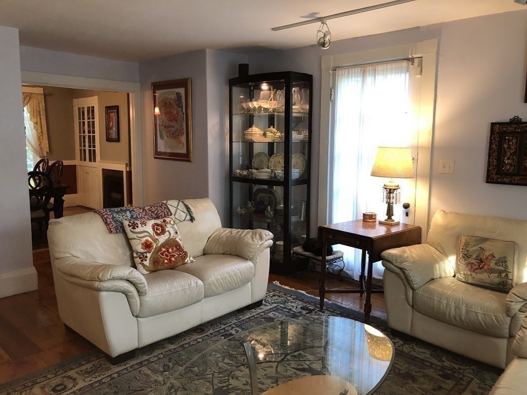 7 Grasshopper Lane Walpole, MA 02081 - Photo 17 of 42 a living room with furniture and a window