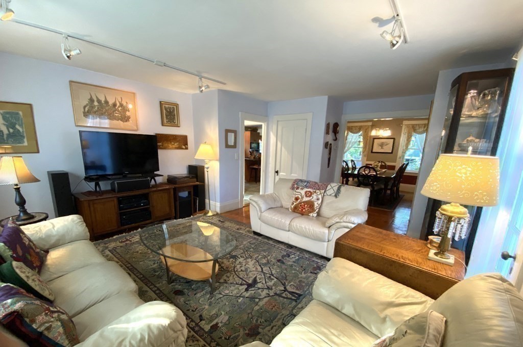 7 Grasshopper Lane Walpole, MA 02081 - Photo 18 of 42 a living room with furniture and a flat screen tv