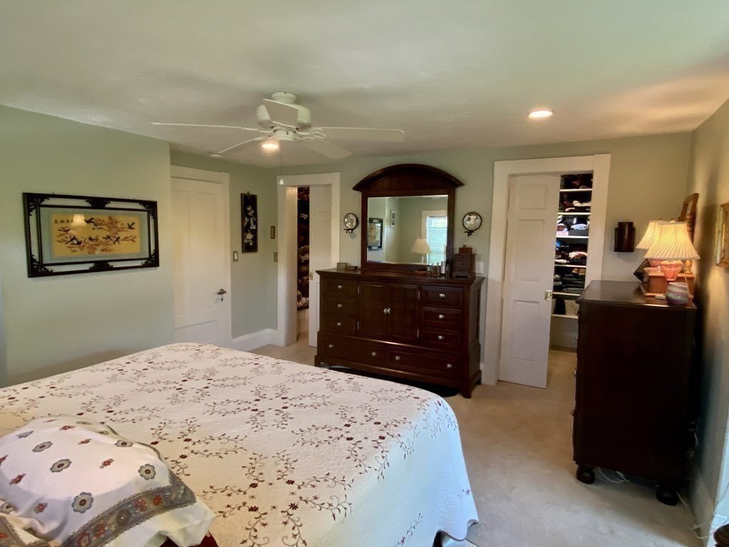 7 Grasshopper Lane Walpole, MA 02081 - Photo 25 of 42 a bedroom with a bed and a dresser