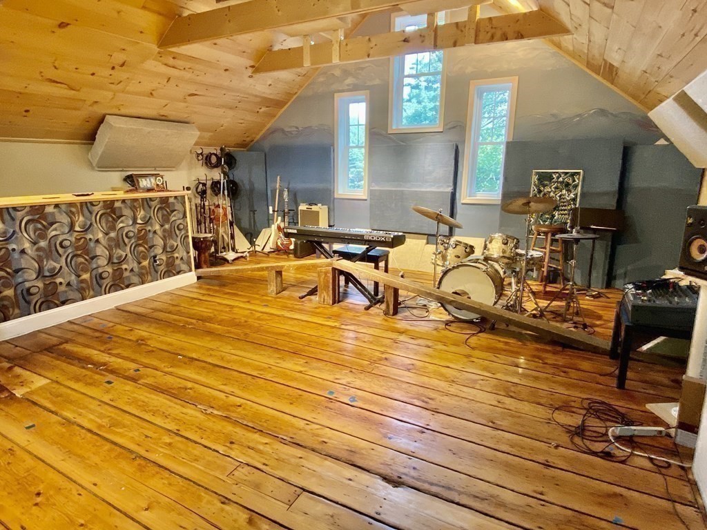 7 Grasshopper Lane Walpole, MA 02081 - Photo 35 of 42 a view of a swimming pool with a table and chairs