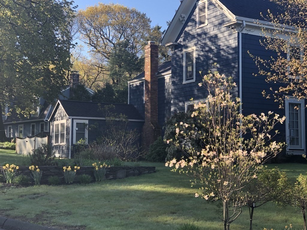 7 Grasshopper Lane Walpole, MA 02081 - Photo 5 of 42 a view of a house with a yard and garden