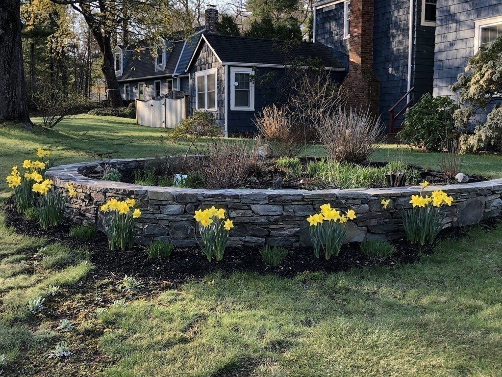 7 Grasshopper Lane Walpole, MA 02081 - Photo 7 of 42 a view of a house with a yard and sitting area