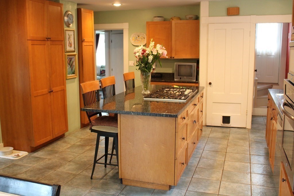 7 Grasshopper Lane Walpole, MA 02081 - Photo 8 of 42 a kitchen with a sink refrigerator and cabinets