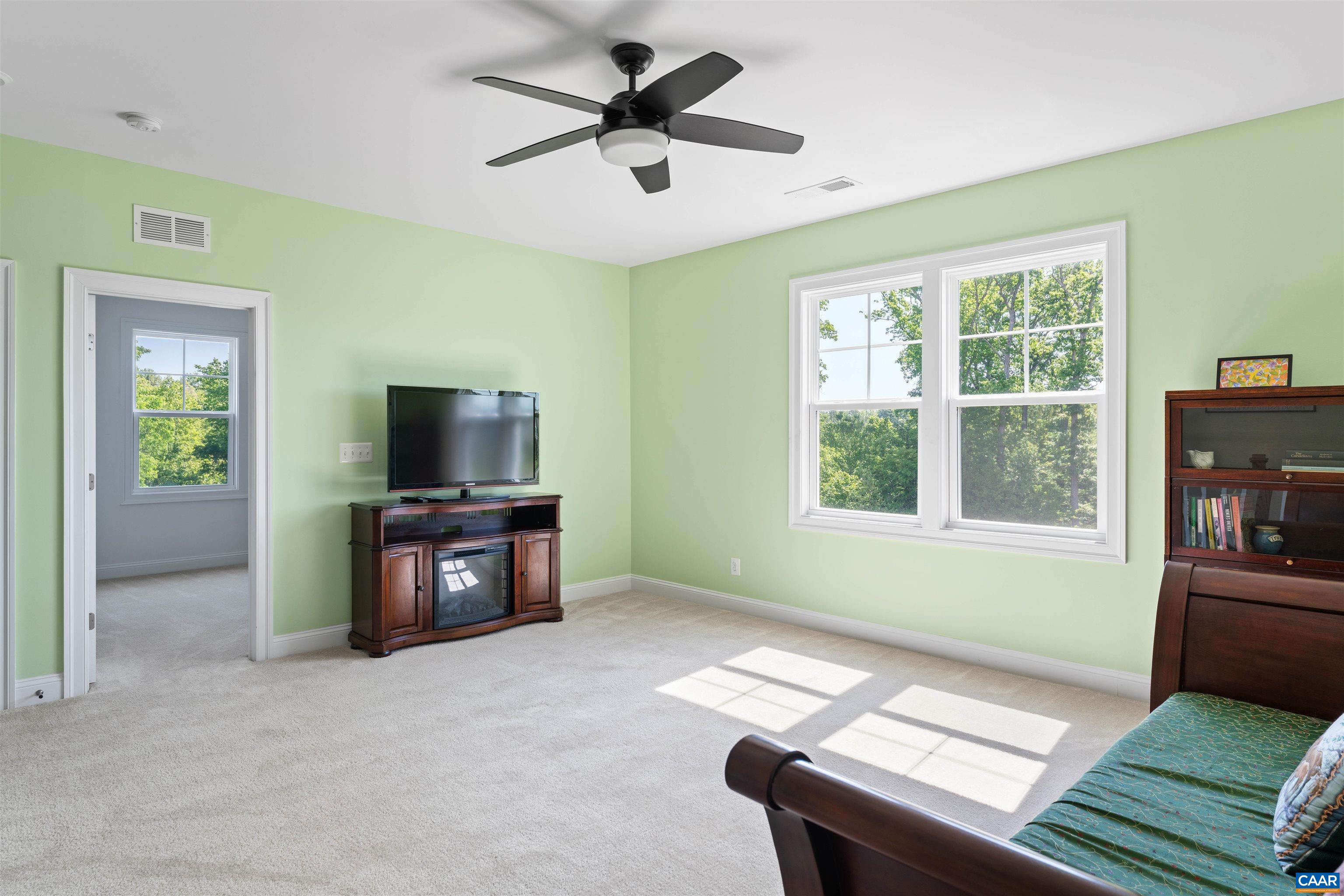 322 Claibourne Road Crozet, VA 22932 - Photo 19 of 25 a living room with furniture and a flat screen tv