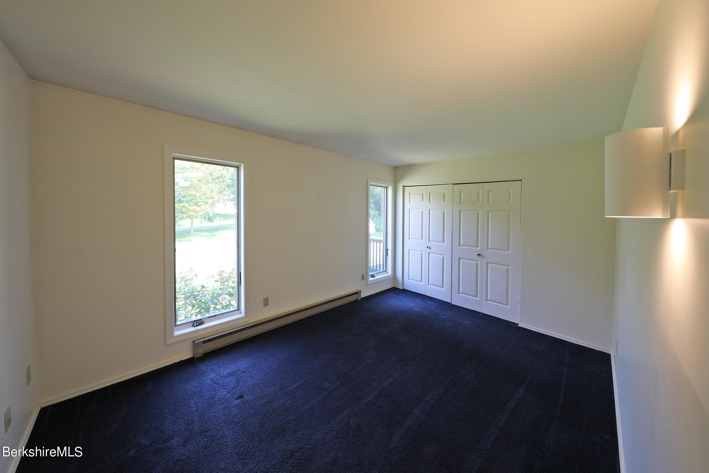 4 Hill Road Stockbridge, MA 01266 - Photo 25 of 41 an empty room with wooden floor and windows