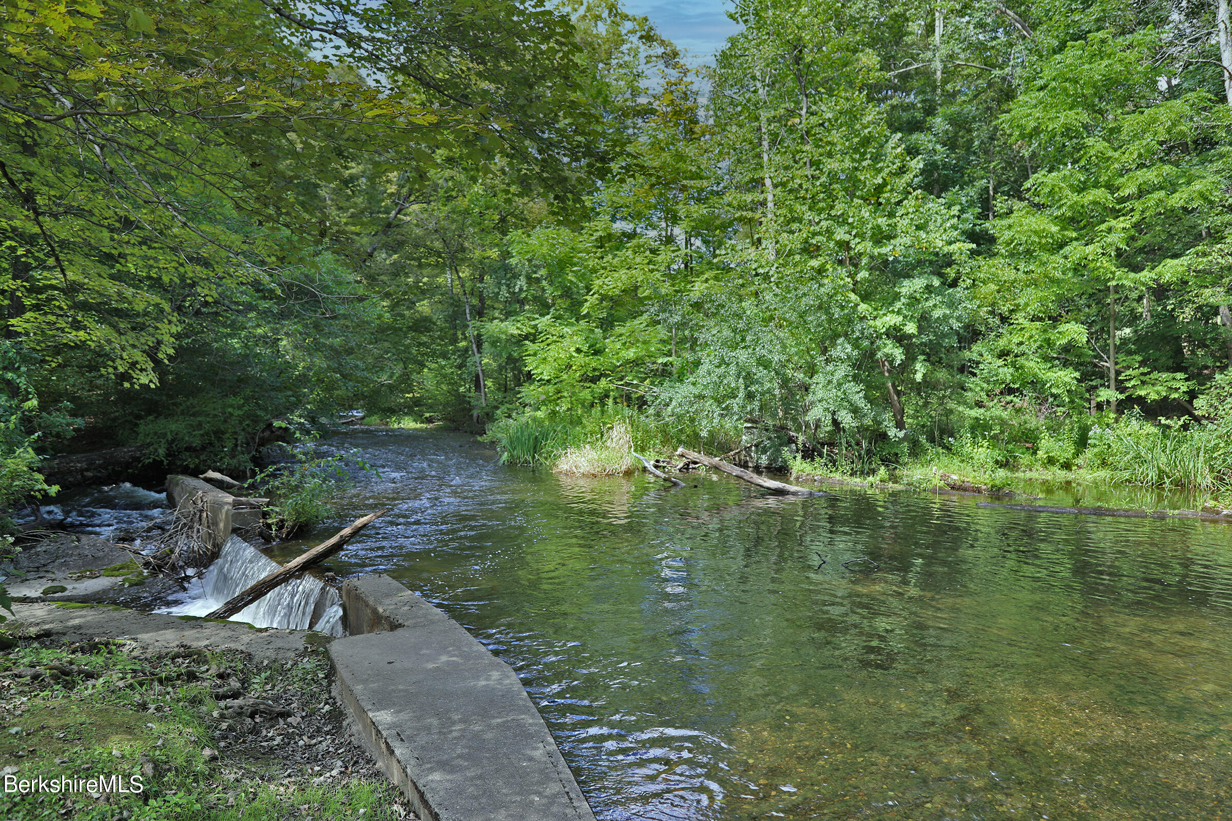 4 Hill Road Stockbridge, MA 01266 - Photo 38 of 41 a view of a lake with a yard
