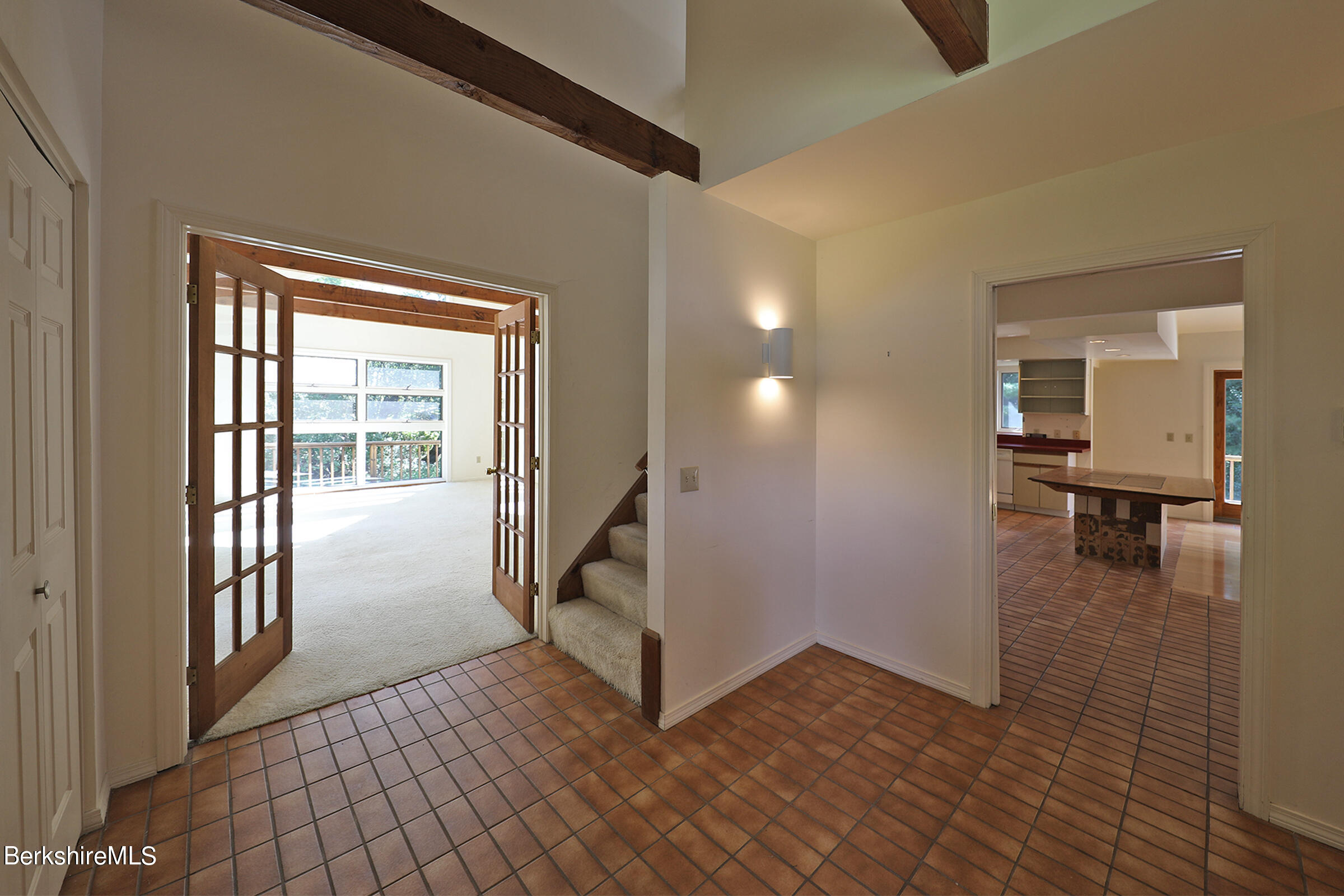 4 Hill Road Stockbridge, MA 01266 - Photo 8 of 41 a view of a hallway to a livingroom with wooden floor and furniture